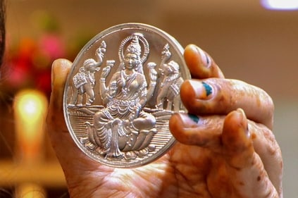 Keeping a silver coin engraved with the image of Goddess Lakshmi is believed to bring luck. (PTI) Keeping a silver coin engraved with the image of Goddess Lakshmi is believed to bring luck. (PTI)