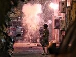 Children burst crackers on the eve of Diwali at Old Rajendra Nagar in New Delhi on Wednesday. (Sanchit Khanna/HT photo)