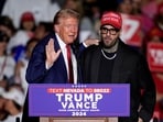 Republican presidential nominee former President Donald Trump, left, greets Nicky Jam during a campaign event at the World Market Center, Friday, Sept.13, 2024, in Las Vegas. 
