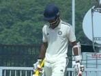 Abhimanyu Easwaran walks off after his dismissal.