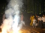 People light fire crackers during Diwali, the festival of lights (AP Photo/Rafiq Maqbool) People light fire crackers during Diwali, the festival of lights (AP Photo/Rafiq Maqbool)