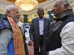 PTI File Photo: Prime Minister Narendra Modi interacts with Congress president Mallikarjun Kharge. CPI national general secretary D. Raja is also seen. PTI File Photo: Prime Minister Narendra Modi interacts with Congress president Mallikarjun Kharge. CPI national general secretary D. Raja is also seen.