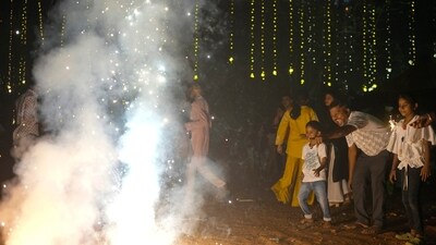 People light fire crackers during Diwali, the festival of lights (AP Photo/Rafiq Maqbool) (AP) People light fire crackers during Diwali, the festival of lights (AP Photo/Rafiq Maqbool) (AP)
