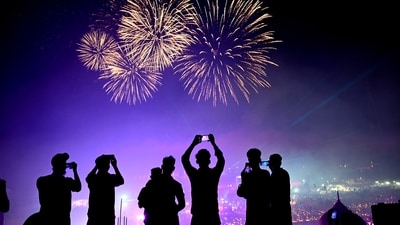 Ayodhya: People watch as fireworks light up the sky above �Ram ki Paidi� during �Deepotsav 2024� near the Saryu river on the eve of the Diwali festival, in Ayodhya, (PTI) Ayodhya: People watch as fireworks light up the sky above �Ram ki Paidi� during �Deepotsav 2024� near the Saryu river on the eve of the Diwali festival, in Ayodhya, (PTI)