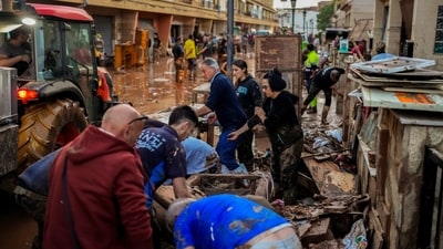 People clean their houses affected by floods in Utiel, Spain, Wednesday, Oct. 30, 2024. (AP) People clean their houses affected by floods in Utiel, Spain, Wednesday, Oct. 30, 2024. (AP)