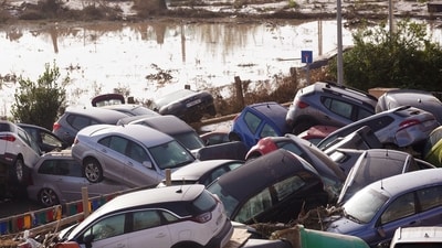 Vehicles are seen piled up after being swept away by floods in Valencia, Spain. (AP) Vehicles are seen piled up after being swept away by floods in Valencia, Spain. (AP)