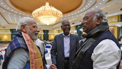 PTI File Photo: Prime Minister Narendra Modi interacts with Congress president Mallikarjun Kharge. CPI national general secretary D. Raja is also seen. PTI File Photo: Prime Minister Narendra Modi interacts with Congress president Mallikarjun Kharge. CPI national general secretary D. Raja is also seen.