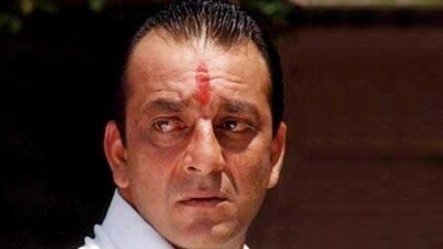 In a powerful scene from Mahesh Manjrekar's Vaastav The Reality (1999), Raghu played by Sanjay Dutt shows off his wealth acquired through illegal means to his family. When his mohter portrayed by late Reema Lagoo scolds him, he says the famous line, “Yeh dekh pachchass tola (Look at this fifty tola).” In a powerful scene from Mahesh Manjrekar's Vaastav The Reality (1999), Raghu played by Sanjay Dutt shows off his wealth acquired through illegal means to his family. When his mohter portrayed by late Reema Lagoo scolds him, he says the famous line, “Yeh dekh pachchass tola (Look at this fifty tola).” 