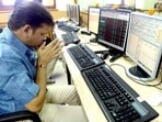 A stock trader prays in front of his trading terminal before Muhurat Trading - a special trading session on the occasion of Diwali. A stock trader prays in front of his trading terminal before Muhurat Trading - a special trading session on the occasion of Diwali.