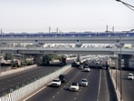 Vehicles move on a road as air quality continues to remain poor, a day after Diwali festival celebrations, in New Delhi, Friday morning, Vehicles move on a road as air quality continues to remain poor, a day after Diwali festival celebrations, in New Delhi, Friday morning,