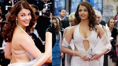 Aishwarya graced Cannes 2004 in a stunning creation by Neeta Lulla. Her white shimmer gown featured a halter neckline, striking cut-out detailing, and an alluring backless design, making her a standout on red carpet. (Instagram) Aishwarya graced Cannes 2004 in a stunning creation by Neeta Lulla. Her white shimmer gown featured a halter neckline, striking cut-out detailing, and an alluring backless design, making her a standout on red carpet. (Instagram)
