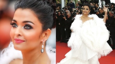 Aishwarya was a vision in white at Cannes 2019, donning a dramatic white furry cape that flowed elegantly alongside her floor-sweeping gown. With her glamorous makeup and stunning diamond drop earrings, she owned the red carpet like the true diva she is. (Instagram) Aishwarya was a vision in white at Cannes 2019, donning a dramatic white furry cape that flowed elegantly alongside her floor-sweeping gown. With her glamorous makeup and stunning diamond drop earrings, she owned the red carpet like the true diva she is. (Instagram)
