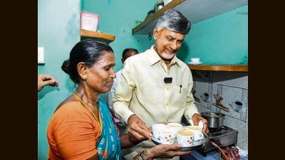 Andhra Pradesh chief minister N Chandrababu Naidu serves tea at the home of a beneficiary during the launch of ‘Deepam-2’, at Eedupuram village in Srikakulam district on Friday. (PTI) Andhra Pradesh chief minister N Chandrababu Naidu serves tea at the home of a beneficiary during the launch of ‘Deepam-2’, at Eedupuram village in Srikakulam district on Friday. (PTI)