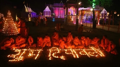 Students from a Hindu religious school light earthen lamps in front of Mani Mandir during the celebrations to mark Diwali, (AFP) Students from a Hindu religious school light earthen lamps in front of Mani Mandir during the celebrations to mark Diwali, (AFP)