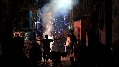 People light firecrackers during the celebrations to mark Diwali in New Delhi. (AFP) People light firecrackers during the celebrations to mark Diwali in New Delhi. (AFP)