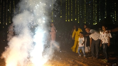 People light firecrackers during Diwali, the festival of lights. (AP Photo/Rafiq Maqbool) (AP) People light firecrackers during Diwali, the festival of lights. (AP Photo/Rafiq Maqbool) (AP)