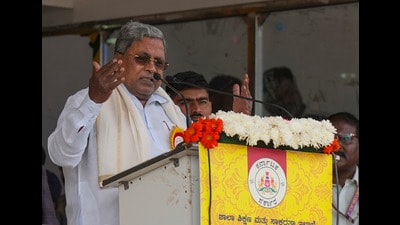 Karnataka Chief Minister Siddaramaiah addresses the celebrations of Karnataka state formation day 'Kannada Rajyotsava', at Sree Kanteerava Stadium, in Bengaluru on Friday. (PTI) Karnataka Chief Minister Siddaramaiah addresses the celebrations of Karnataka state formation day 'Kannada Rajyotsava', at Sree Kanteerava Stadium, in Bengaluru on Friday. (PTI)