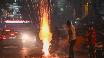 People burst firecrackers during Diwali festivities at Patel Nagar in New Delhi on Thursday. (Sanchit Khanna/HT Photo)