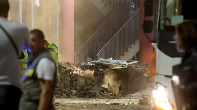 A bicycle sits between rubbles at the scene where the roof of a train station collapsed, killing several people in Serbia (REUTERS)