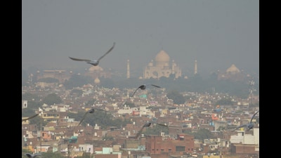 The Taj Mahal complex is obscured by smog, a day after the festival of Diwali, in Agra on Friday. (PTI)