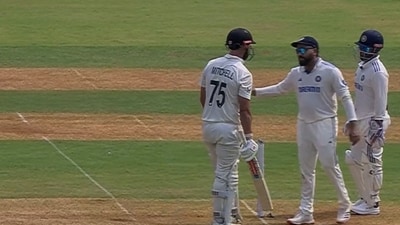 Rohit Sharma chats with Daryl Mitchell during the 3rd Test (X) Rohit Sharma chats with Daryl Mitchell during the 3rd Test (X)