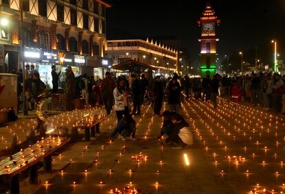 People light 'diyas' during the Diwali festival celebrations at Lal Chowk, in Srinagar, Thursday night. (PTI) People light 'diyas' during the Diwali festival celebrations at Lal Chowk, in Srinagar, Thursday night. (PTI)