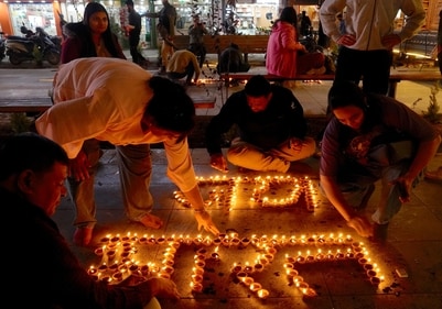 People light 'diyas' to form 'Jaya Bharat' during the Diwali festival celebrations at Lal Chowk in Srinagar on Thursday. (PTI) People light 'diyas' to form 'Jaya Bharat' during the Diwali festival celebrations at Lal Chowk in Srinagar on Thursday. (PTI)