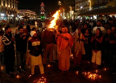 A priest performs 'puja' during the Diwali festival celebrations at Lal Chowk, in Srinagar, Thursday night. (PTI) A priest performs 'puja' during the Diwali festival celebrations at Lal Chowk, in Srinagar, Thursday night. (PTI)