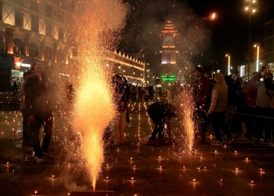 People burst firecrackers during the Diwali festival celebrations at Lal Chowk, in Srinagar on Thursday. (PTI) People burst firecrackers during the Diwali festival celebrations at Lal Chowk, in Srinagar on Thursday. (PTI)
