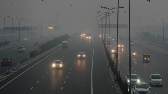 Vehicles move on a road amid low visibility due to smog, a day after Diwali festival celebrations, in New Delhi, early Friday morning, Nov. 1, 2024. (PTI Photo/Kamal Singh)