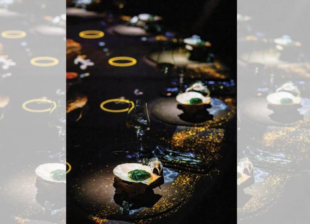 At Dubai’s Krasota, virtual lemons roll and bump against real wineglasses and koi swim around the table.