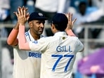India's Ravichandran Ashwin (L) celebrates with Shubman Gill after taking a catch to dismiss New Zealand's Daryl Mitchell. India's Ravichandran Ashwin (L) celebrates with Shubman Gill after taking a catch to dismiss New Zealand's Daryl Mitchell.