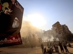 A poster of slain Hezbollah leader Hasan Nasrallah hangs near the smouldering rubble of a building in the aftermath of overnight Israeli airstrikes that targeted the neighbourhood of Kafaat in Beirut's southern suburbs on November 1, 2024. (Photo by AFP)
