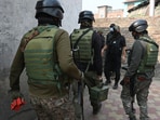 
Paramilitary soldiers move towards the site of encounter, in Khanyar area of Srinagar on Saturday