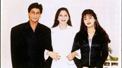 Shah Rukh Khan with wife Gauri Khan posing with Simi Garewal. 