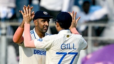 India's Ravichandran Ashwin (L) celebrates with Shubman Gill after taking a catch to dismiss New Zealand's Daryl Mitchell. (AFP) India's Ravichandran Ashwin (L) celebrates with Shubman Gill after taking a catch to dismiss New Zealand's Daryl Mitchell. (AFP)