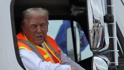 Donald Trump spent a day donning the garbage collector uniform and jumping into a truck, to portray Democrats as elitists and project himself as a champion of the working class. (AP) Donald Trump spent a day donning the garbage collector uniform and jumping into a truck, to portray Democrats as elitists and project himself as a champion of the working class. (AP)