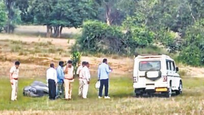 Police and forest officials examine the site where an elephant was found dead on Wednesday. (PTI) Police and forest officials examine the site where an elephant was found dead on Wednesday. (PTI)