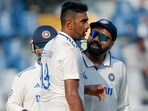 India's Captain Rohit Sharma and Ravichandran Ashwin celebrate the wicket of New Zealand's Glenn Phillips India's Captain Rohit Sharma and Ravichandran Ashwin celebrate the wicket of New Zealand's Glenn Phillips