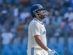 India's Captain Rohit Sharma walks back to the pavilion after getting dismissed.