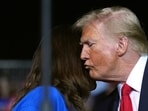 Republican presidential nominee former President Donald Trump kisses a family member as Tammy Nobles, mother of Kayla Hamilton, finishes speaking at a campaign rally at the Salem Civic Center, Saturday, Nov. 2, 2024, in Salem, Va. (AP Photo/Evan Vucci)