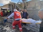 Rescuers evacuate a body at the site of an Israeli airstrike that targeted a village near the Syrian border with Lebanon Rescuers evacuate a body at the site of an Israeli airstrike that targeted a village near the Syrian border with Lebanon