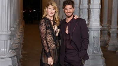 Laura Dern and Andrew Garfield posed together at the LACMA Art+Film Gala red carpet. While Laura chose a lace-embroidered black semi-sheer gown, Andrew completed her in a deep plum suit set. (AFP) Laura Dern and Andrew Garfield posed together at the LACMA Art+Film Gala red carpet. While Laura chose a lace-embroidered black semi-sheer gown, Andrew completed her in a deep plum suit set. (AFP)
