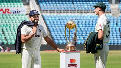 Indian captain Rohit Sharma interacts with his Australian counterpart Pat Cummins. (PTI) Indian captain Rohit Sharma interacts with his Australian counterpart Pat Cummins. (PTI)