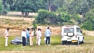 Police and forest officials examine the site where an elephant was found dead on Wednesday. (PTI) (HT_PRINT)