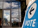 A voter arrives to cast their ballot at the King County Elections headquarters in Renton, Washington, US, on Monday. (Bloomberg) A voter arrives to cast their ballot at the King County Elections headquarters in Renton, Washington, US, on Monday. (Bloomberg)