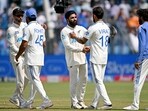 New Zealand's Ajaz Patel (3L) and Devon Conway (L) shake hands with India's Virat Kohli (2R) and captain Rohit Sharma (2L) New Zealand's Ajaz Patel (3L) and Devon Conway (L) shake hands with India's Virat Kohli (2R) and captain Rohit Sharma (2L)