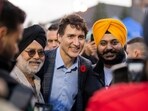 Canada Prime Minister Justin Trudeau poses for photos with fans as he tours various vendors at the Diwali Mela festival at Sesquicentennial Park in Brampton, Ontario on Friday.
