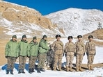 Indian and Chinese army greet each other along the Line of Actual Control (LAC) near Karakoram pass in Ladakh on Thursday. (AFP)
