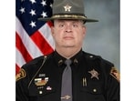 The sheriff’s office said Rodgers, who has commanded the department's road patrol, would remain on duty, with a written reprimand for violating the department’s social media policy.